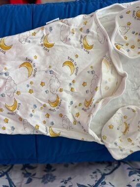 Swinging on a Star Baby’s White Swaddle with Yellow Moon & Star Print